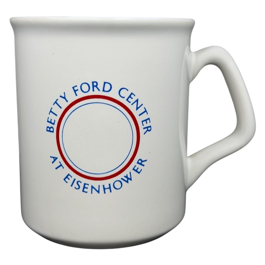 Ceramic mug featuring the Betty Ford Center At Eisenhower logo in blue and red design