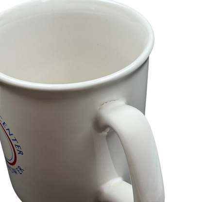 White ceramic Betty Ford Center At Eisenhower mug with a round handle for beverages