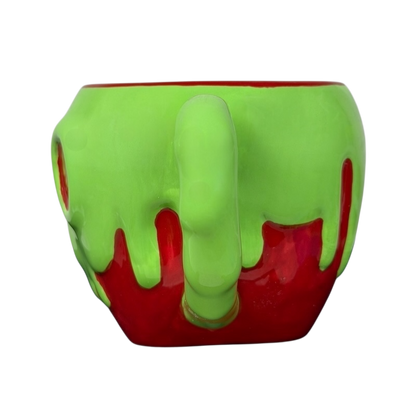 Disney Snow White Evil Queen Green Poison Apple Mug Bioworld with a vibrant green dripping design