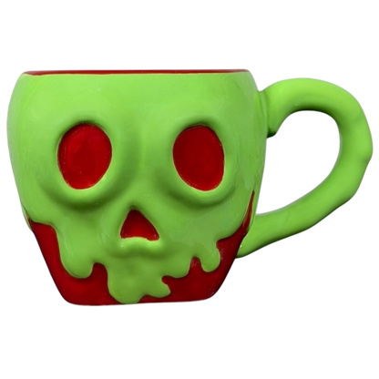Disney Snow White Evil Queen Green Poison Apple Mug Bioworld with a skull design and vibrant colors