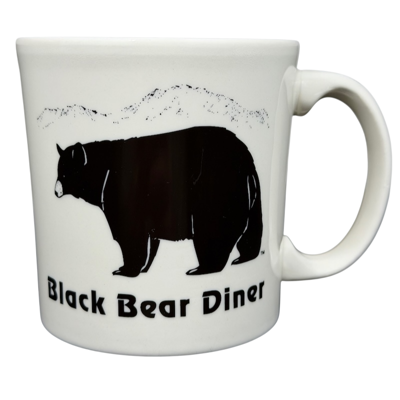 Black Bear Diner Mug Homer Laughlin China featuring a black bear silhouette and scenic mountains