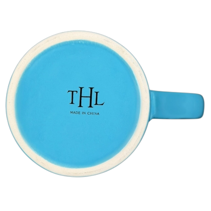 Top view of THL #Blessed blue collectible mug showcasing its vibrant design and craftsmanship