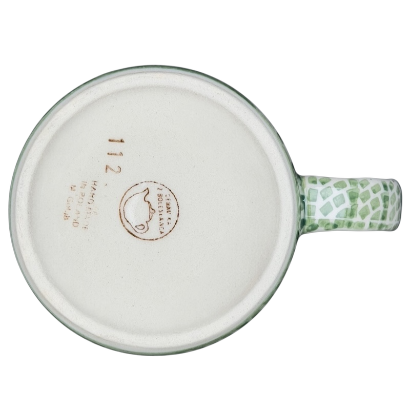 Bottom view of Boleslawiec forget-me-not mug featuring a unique handle design and decorative pattern