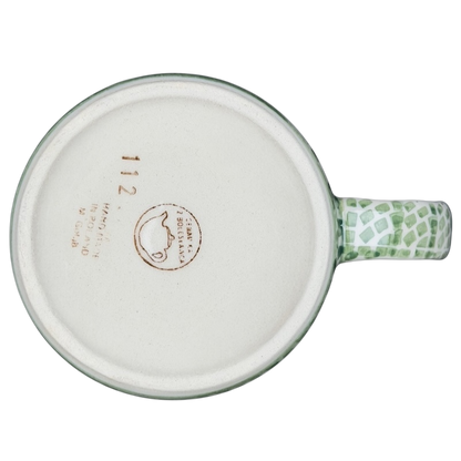 Bottom view of Boleslawiec forget-me-not mug featuring a unique handle design and decorative pattern
