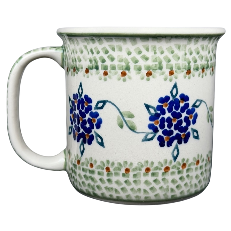 Boleslawiec forget-me-not mug featuring blue floral design and green accents on a white background