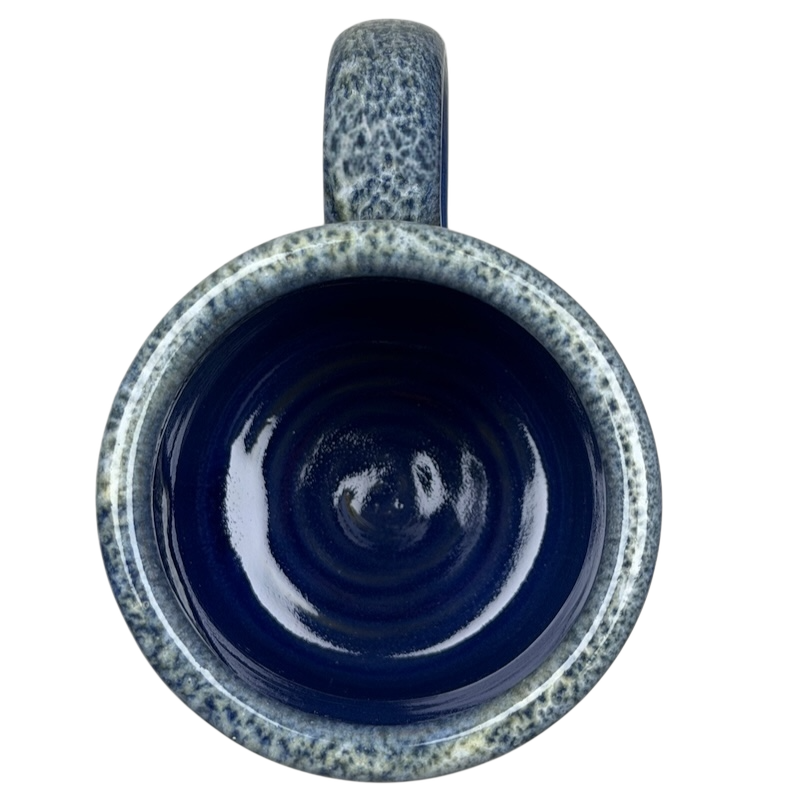 Inside view of a Boulder Mountain Lodge Utah Deneen mug with a glossy blue finish and textured design