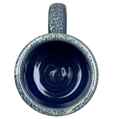 Inside view of a Boulder Mountain Lodge Utah Deneen mug with a glossy blue finish and textured design