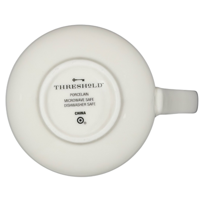 Bottom view of Threshold Bright Eyed Bushy Tailed Squirrel Mug showing porcelain material and care instructions