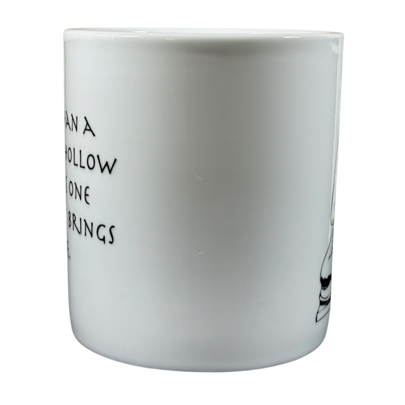 White ceramic Buddha collectible Coventry mug with black text and Buddha illustration