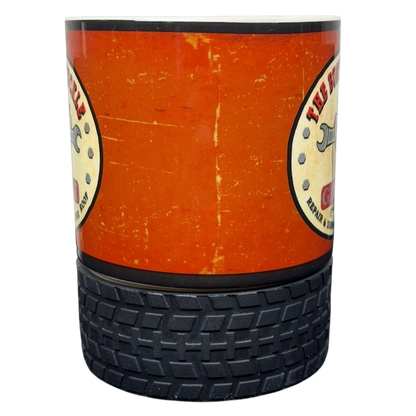Busted Knuckle Garage Logo Tire Base Mug with an orange and black design for car enthusiasts
