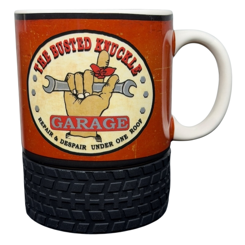 Busted Knuckle Garage Logo Tire Base Mug with a wrench design and a rubber tire base for automotive enthusiasts