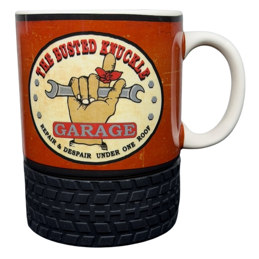 Busted Knuckle Garage Logo Tire Base Mug with a wrench design and a rubber tire base for automotive enthusiasts