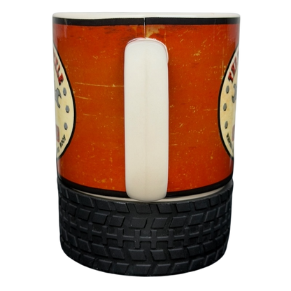 Busted Knuckle Garage Logo Tire Base Mug featuring a durable tire design and a bold logo
