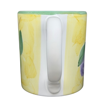 Caleca Frutta Pear and Plums mug featuring colorful fruit illustrations on a vibrant background