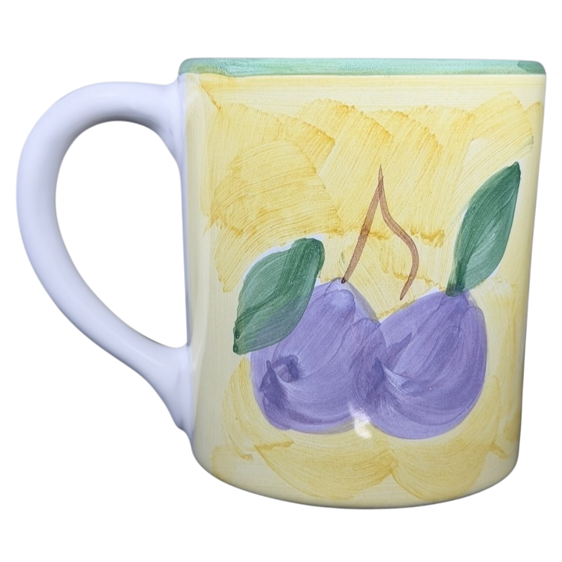 Caleca Frutta Pear and Plums mug featuring hand-painted plums on a yellow background
