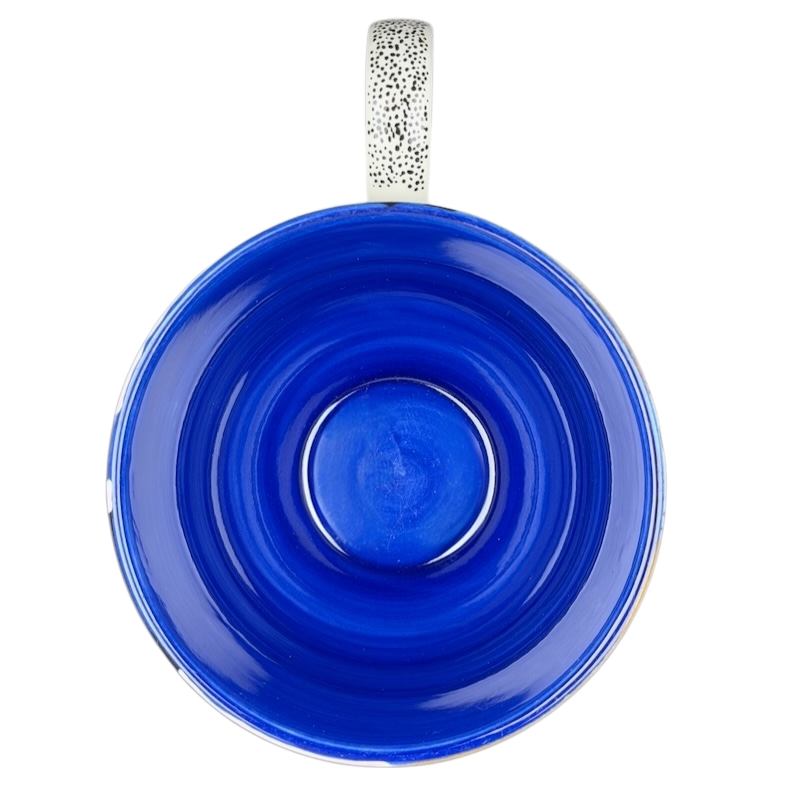 Cassie Byrnes Anthropologie Mug in deep blue with a glossy spiral design and textured handle