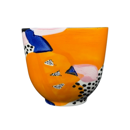 Colorful Cassie Byrnes Anthropologie Mug with Abstract Patterns and Vibrant Orange Background