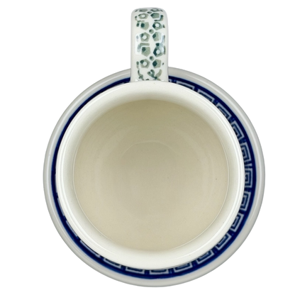 Top view of Polish Pottery Tea Infuser Brewing Boleslawiec Mug Ceramika Artystyczna with intricate design