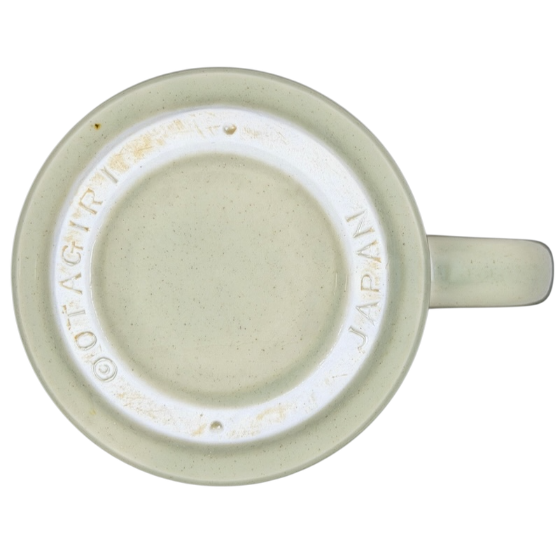 Bottom view of Classic Cars Mug vintage Otagiri showcasing the maker's mark and speckled ceramic detail