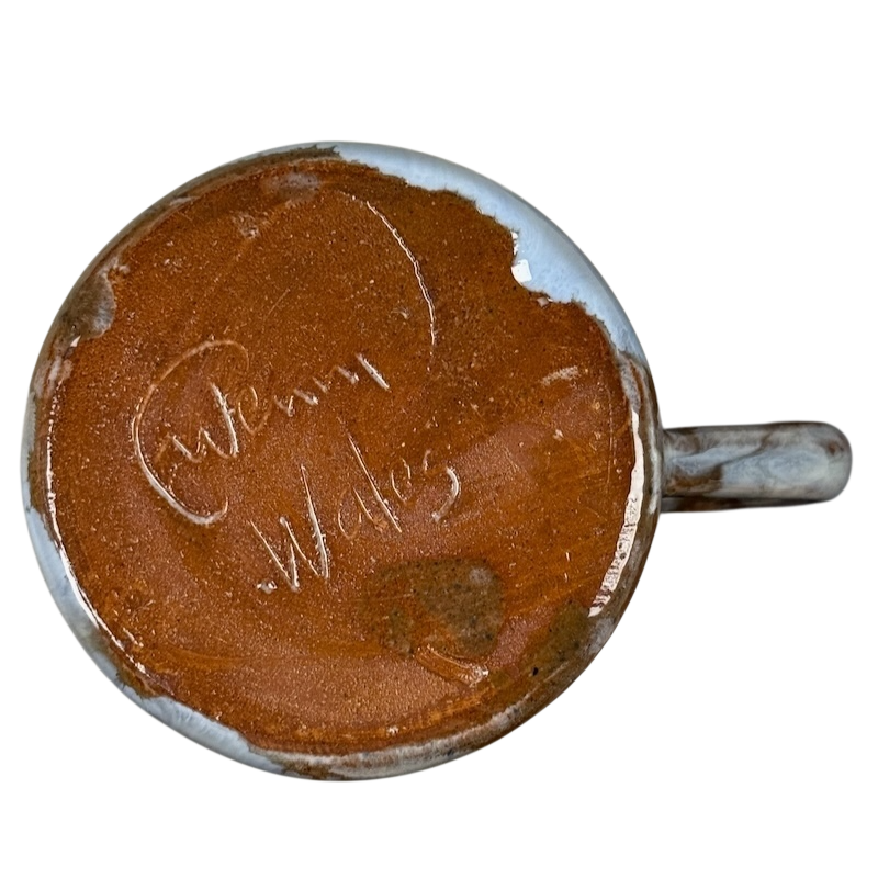 Signed base view of Queen's Silver Jubilee vintage 1977 pottery mug showing artist signature and handle