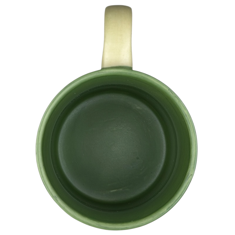 Interior view of a Colorado fast food bear mug collectible in green ceramic