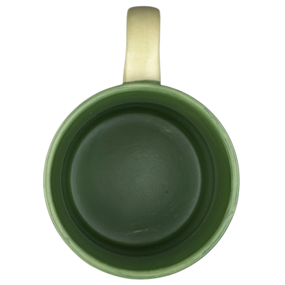 Interior view of a Colorado fast food bear mug collectible in green ceramic