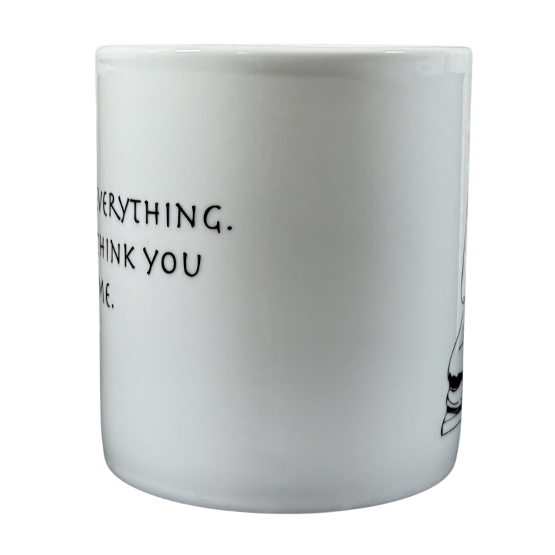 White Coventry Buddha collectible coffee mug with partial black text and Buddha illustration on side