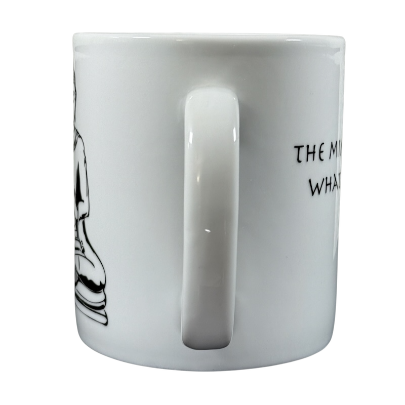 White Coventry Buddha collectible coffee mug with black Buddha illustration and partial text on side