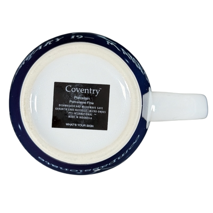 Bottom view of Coventry Pisces astrology collectible mug showing Coventry label and navy blue zodiac rim