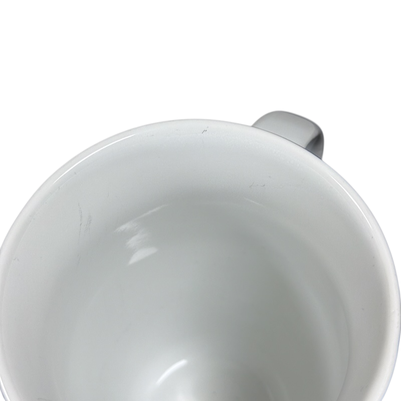 Top view of white ceramic Coventry Pisces astrology collectible mug showing glossy interior and handle