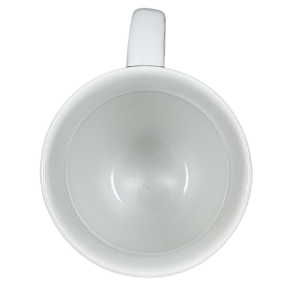 Top view of white ceramic Coventry Pisces astrology collectible mug showing empty glossy interior and handle on black background