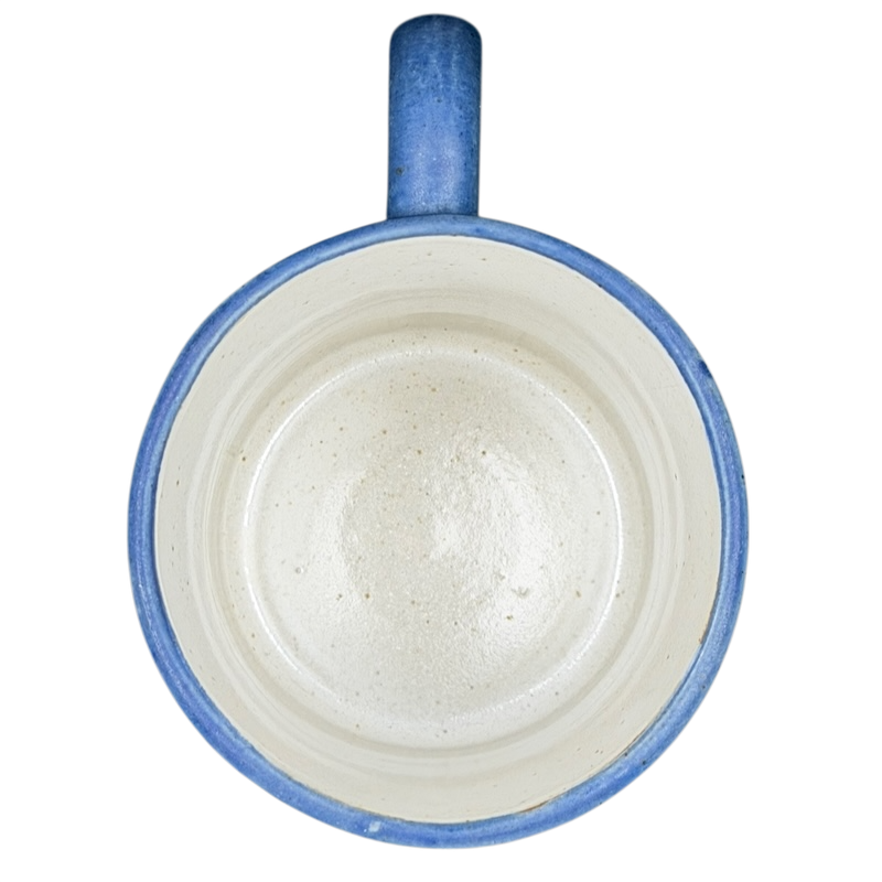 Top view of a blue ceramic Deer Logo Mug Caribou Coffee with a smooth, unglazed interior