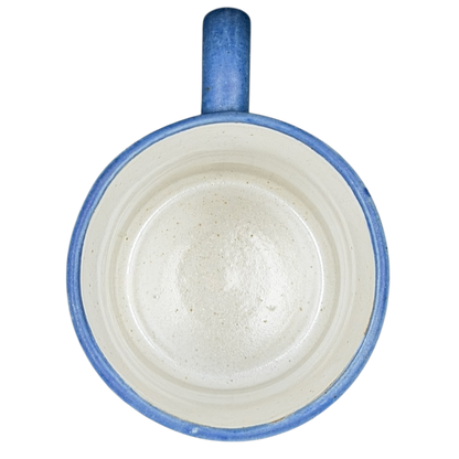 Top view of a blue ceramic Deer Logo Mug Caribou Coffee with a smooth, unglazed interior