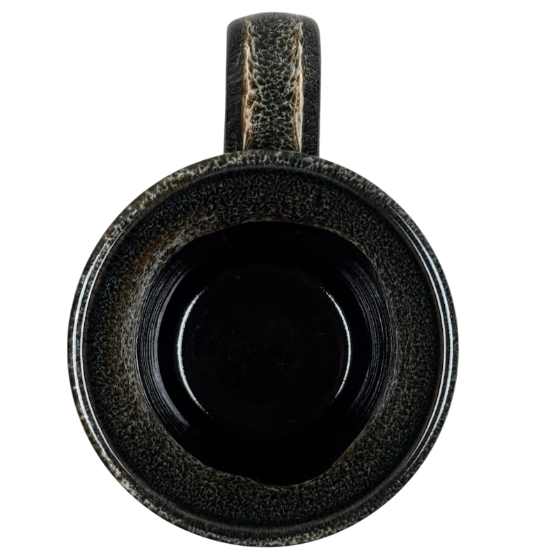 Top view of Deneen Pottery Devil's Thumb Ranch mug 2017 with textured dark glaze and sturdy handle