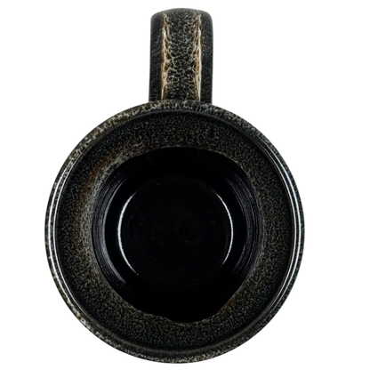 Top view of Deneen Pottery Devil's Thumb Ranch mug 2017 with textured dark glaze and sturdy handle