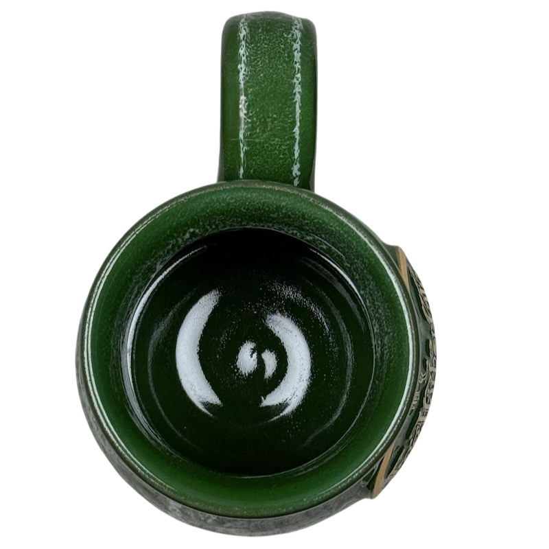 Top view of green glazed Deneen Pottery Egg Harbor Rockford Illinois vintage mug with handle and glossy interior