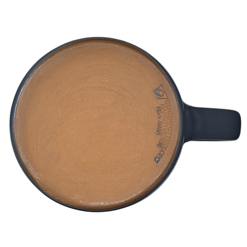 Top view of Grand Canyon National Park Deneen Pottery collectible mug with unglazed terracotta base and blue handle
