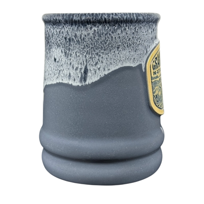 Grand Canyon National Park Deneen Pottery collectible mug. Gray stoneware with white drip glaze and embossed park badge