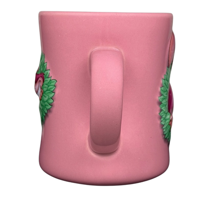 Alice In Wonderland Cheshire Cat Mug Disney in pink with colorful floral designs on the sides