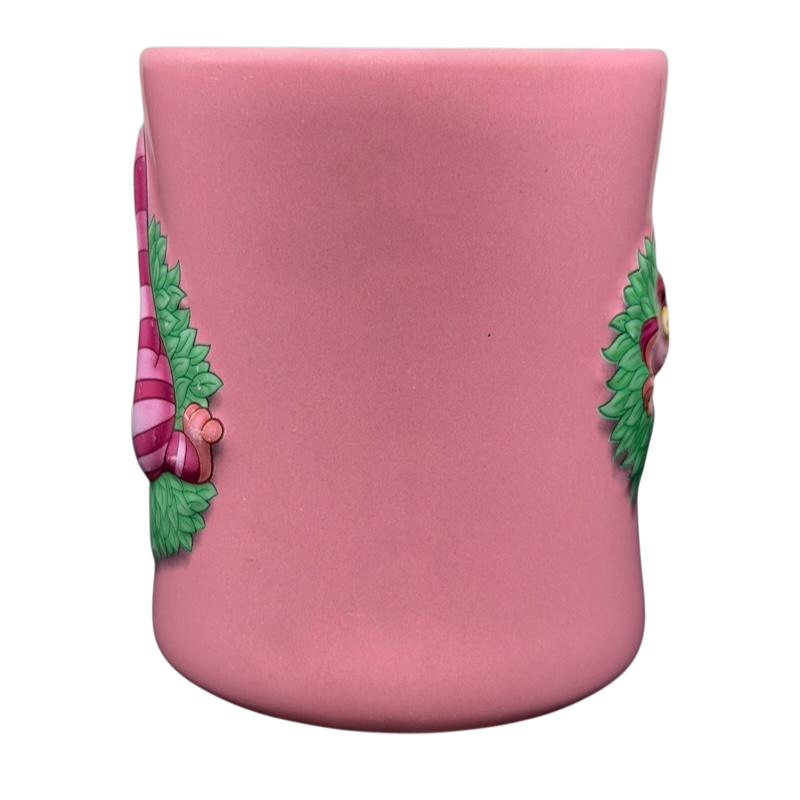 Alice In Wonderland Cheshire Cat Mug Disney in pink with detailed illustrations of the Cheshire Cat