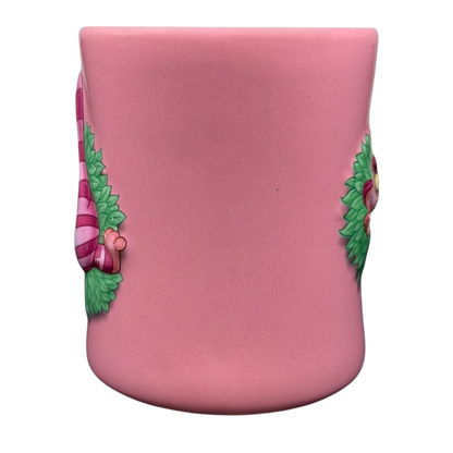 Alice In Wonderland Cheshire Cat Mug Disney in pink with detailed illustrations of the Cheshire Cat