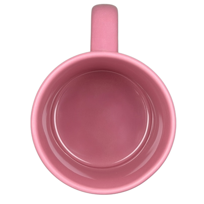 Top view of a pink ceramic Alice In Wonderland Cheshire Cat Mug Disney with a smooth interior finish