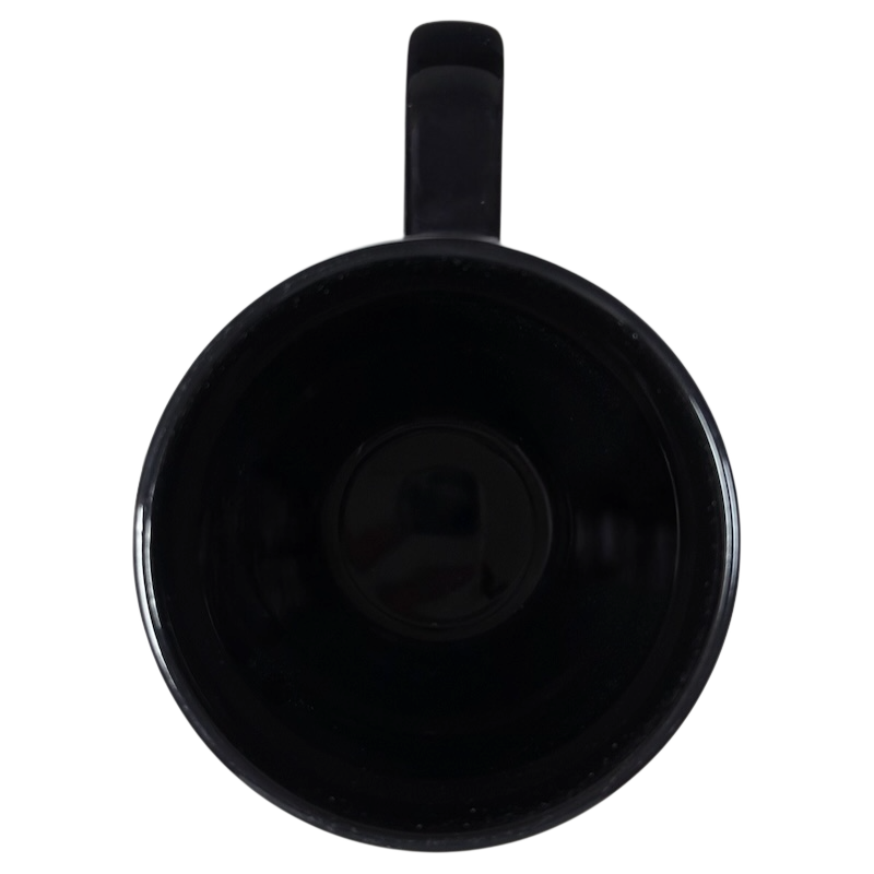 Top view of a black Disney Alice Through The Looking Glass collectible mug with a handle