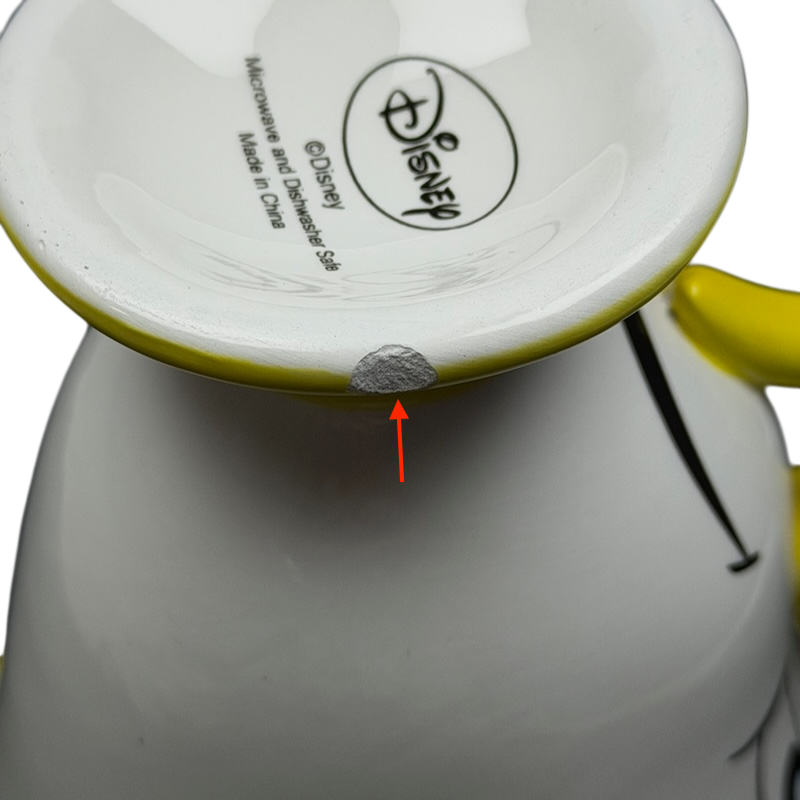 Bottom view of Disney Beauty and the Beast Chip Potts Smiling Mug with a bright yellow rim