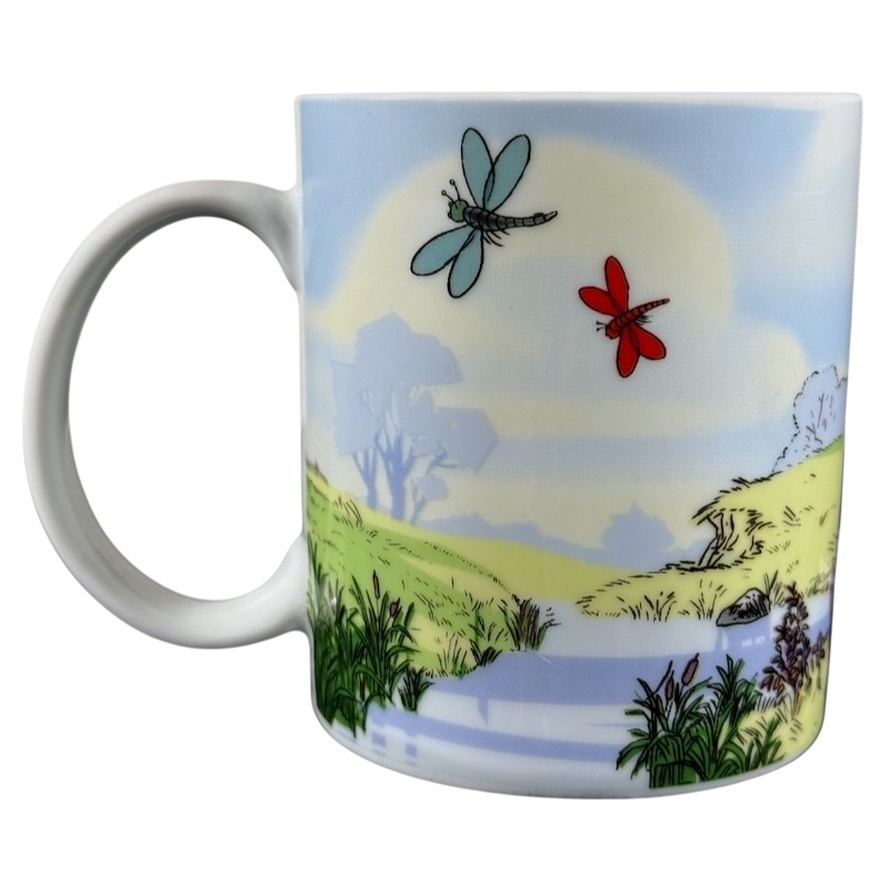 Disney collectible mug Eeyore Piglet with scenic nature design and colorful dragonflies