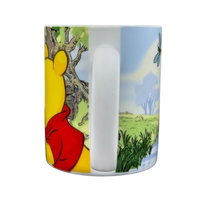 Disney collectible mug Eeyore Piglet featuring colorful Winnie the Pooh characters and a scenic forest background
