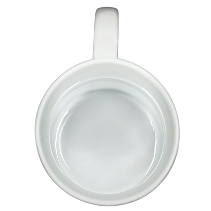 Top view of empty white Disney collectible mug Eeyore Piglet with handle on black background