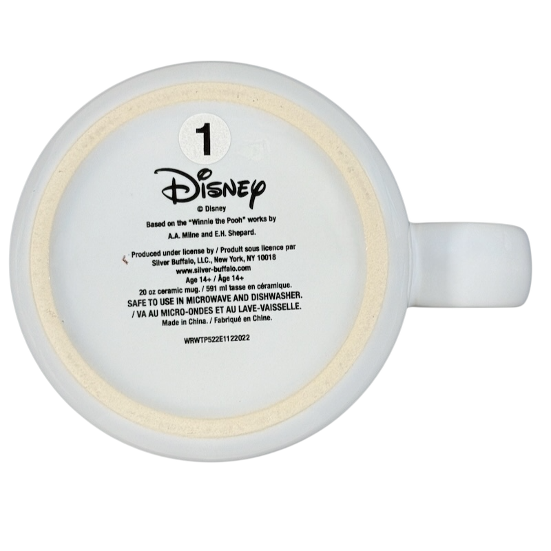 Bottom view of Disney collectible Winnie the Pooh mug showing product and care details
