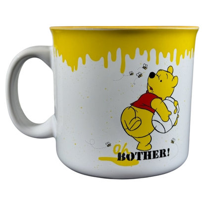 Disney collectible Winnie the Pooh mug with yellow honey drip design and Oh Bother text