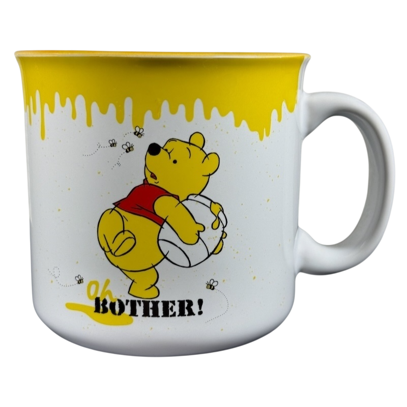 Disney collectible Winnie the Pooh mug with yellow honey drip design and Oh Bother quote